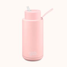 a pink water bottle with a straw sticking out of it's top, on a white background