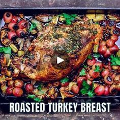 roasted turkey breast with vegetables and apples in a roasting pan