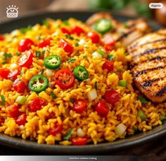 a close up of a plate of food with rice and vegetables on it, including chicken