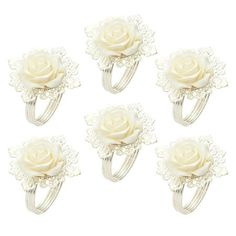 six white roses with lace on them are arranged in the shape of an adjustable ring