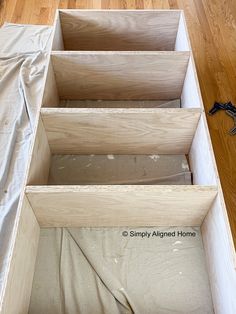 the inside of a wooden box is being prepared for paint and woodwork to be finished