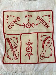 a red and white dish towel with embroidered designs on it's side, along with the words comb and brush