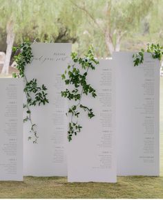 the seating cards are covered with greenery