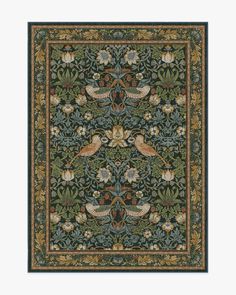 an intricately designed rug with birds and flowers