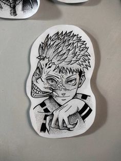 two plates with drawings on them and one has a person's face in the middle