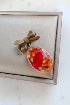 Vintage Resin Red Rose Bow Brooch. Length: 1 3/4" Width: 7/8" Vintage condition! please zoom in. Back to the shop: https://www.etsy.com/shop/SusVintage?ref=hdr_shop_menu If you have any questions feel free to contact me. Thank you!! Vintage Red Pins For Gifts, Vintage Red Pins For Gift, Vintage Red Pins As Gift, Red Brooches For Valentine's Day, Red Brooch For Anniversary On Valentine's Day, Red Brooches For Anniversary And Valentine's Day, Red Brooch Pins For Valentine's Day, Red Flower Brooches For Gift, Handmade Vintage Red Brooches