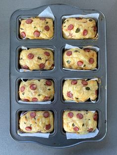 six muffins with pepperoni and cheese in a pan