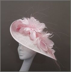 Delicate pale pink medium sized disc fascinator with matching feather mount and diamanté attached on a headband. This british style saucer hat is perfect for a day at the races, wedding or formal event. This hat is made to order, orders take approximately 2-3 weeks to be made. All items are sent via a tracked delivery method, the delivery price for overseas purchases includes tracked and signed. Designs can be made to order in a range of different colours or styles, see our colour chart: www.jac Pink Pinched Crown Fascinator For Formal Occasions, Pink Formal Fascinator With Pinched Crown, Pink Curved Brim Fascinator For Events, Pink Curved Brim Fascinator For Event, Pink Feathered Fascinator For Races, Pink Curved Brim Fascinator For Special Event, Pink Feathered Fascinator For Evening, Pink Feather Fascinator For Royal Ascot, Pink Feathered Formal Hat