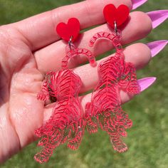 "Big and beautiful! Glittery pink tigers attached to red heart shaped studs. The tigers feature hand painted details and measure 2.5\" tall." Hand Painted Red Jewelry For Valentine's Day, Hand-painted Red Jewelry For Valentine's Day, Trendy Red Hand Painted Earrings, Tiger Earrings, Bridal Theme, Pink Tiger, Polymer Earrings, Funky Earrings, Orange Earrings