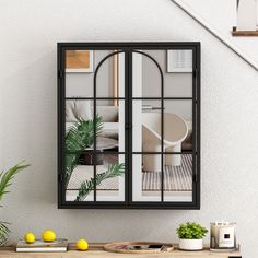 an open window reflecting a living room and dining area with potted plants on the table