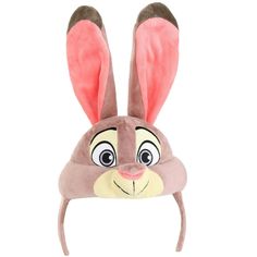 a stuffed animal hat with ears on it's head and eyes drawn to look like a bunny