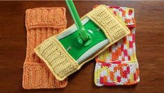 two cleaning cloths and a mop on a table