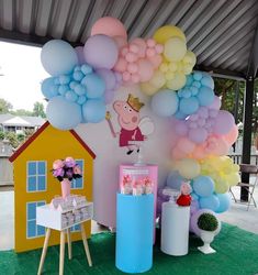 a party setup with balloons and decorations for pep the pig themed birthday party at home