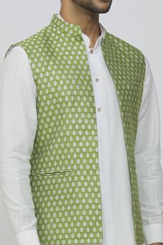 Olive green brocade silk open jacket with tiny floral-paisley prints. Comes with an off white dupion silk button down kurta and an off white dupion silk Mexican pant.
Components: 3
Pattern: Printed
Type Of Work: Paisley-Floral
Neckline: Mandarin
Sleeve Type: Straight Full
Fabric: Brocade Silk
Color: Green
Other Details: 
Jacket:
Front open
Sleeveless
Welt pockets
Kurta:
Front button placket
Side slits
Cuff sleeves
Apple hem cut
Pant:
Side pockets
Occasion: Wedding - Aza Fashions Kurta Set For Men, Open Jacket, Nehru Jackets, Dupion Silk, Straight Kurta, Floral Jacket, Paisley Floral, Silk Jacket, Fashion App