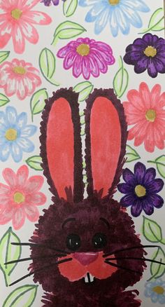 a drawing of a rabbit surrounded by flowers