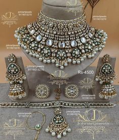 an elaborate necklace and earring set with pearls on display in front of a mannequin