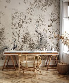 the wallpaper in this dining room is painted with peacocks