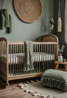 a baby crib in a room with green walls and rugs on the floor