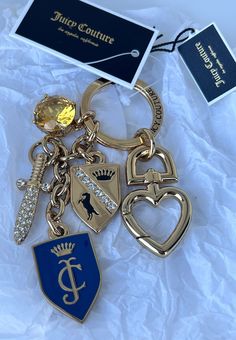 WITH ORIGINAL UPC TAG! You are paying for a  100% AUTHENTIC High-Quality JUICY COUTURE item that will last forever   🎀🎀BRAND NEW! 🎀🎀 HARD TO FIND KEY FOB 100% authentic, with Original Tag. GLAMOROUS JUICY COUTURE SHIELD & SWORD KEYFOB.  14k Gold Plating on Solid BRASS and sparkly rhinestone detail. Juicy Couture Keychain, Designer Keychain, Keychain Charms, Gold Keychain, Pirate Treasure, Juicy Couture Jewelry, Juicy Couture Bags, Key Fobs, Cute Bags