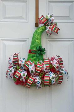 a christmas wreath hanging on the front door