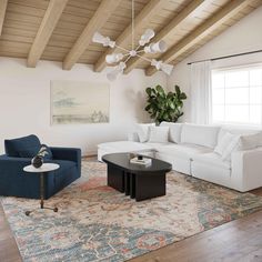 a living room filled with furniture and a rug