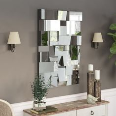 a mirror that is on the side of a wall next to a table and chair