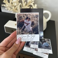 a person holding up a card with photos on it and the words save the date