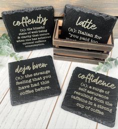 four slate coasters with different sayings on them