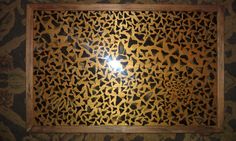 an intricately designed wooden panel in a room