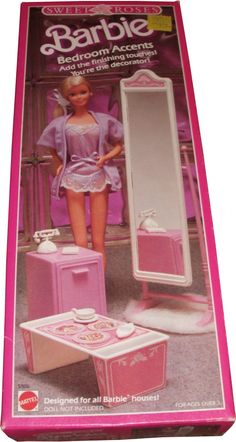 the barbie doll is standing in front of her dressing table and mirror with pink accessories