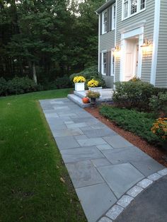 a house with landscaping in front of it