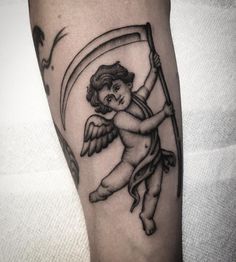 an angel holding a flag tattoo on the arm