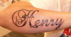 a man's arm with the word henry written in cursive writing on it