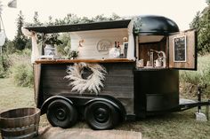 an old trailer converted into a mobile bar