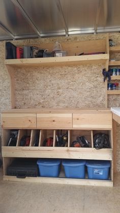 the inside of a storage area with bins and shelves