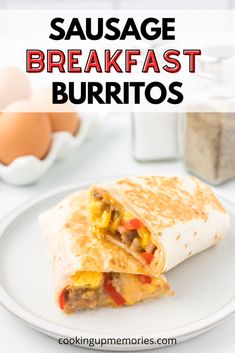 sausage breakfast burritos on a plate with eggs in the background and text overlay reading sausage breakfast burritos