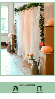 an image of a wedding ceremony with flowers on the wall and tulle curtains in the background