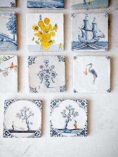 six handmade tiles with different designs on them