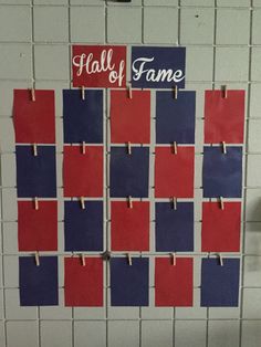 a bulletin board with red, white and blue squares pinned to it's sides