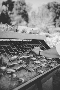 a man is grilling food on an outdoor grill