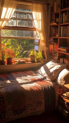 a bed sitting under a window next to a bookshelf filled with lots of books