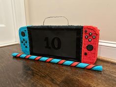 a nintendo wii game controller made out of yarn