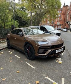 a brown sports car parked on the street