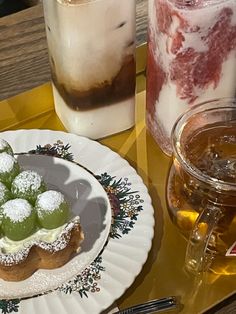 desserts and drinks are sitting on a tray