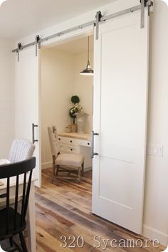 an open door leading into a dining room