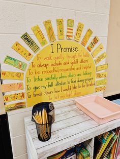 a bulletin board with writing on it in front of a book shelf filled with children's books