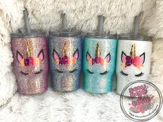 three unicorn tumbles with their lids painted in different colors