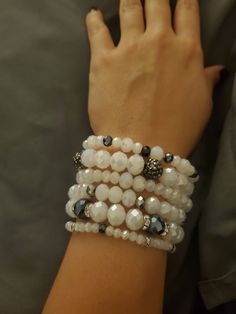 Beautiful white and metallic blue beaded bracelets that are perfect for everyday wear whether it be out and about or a night out!  They are made with stretch cord so you can slip them on and off!  Set of 6 bands.  Can customize to an extent, please message me. White Multi-strand Bracelet As Gift, White Multi-strand Beaded Bracelets As Gift, White Stackable Bracelets For Party, White Multi-strand Beaded Bracelets With Spacer Beads, Flexible White Beaded Stretch Bracelet, Adjustable White Stretch Bracelet For Party, Adjustable White Hand-strung Wrap Bracelet, Adjustable Hand-strung White Wrap Bracelet, White Adjustable Beaded Bracelets For Parties