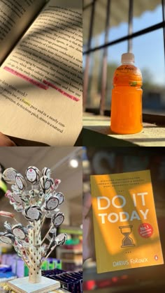 there is a book and an orange bottle on the table next to each other,