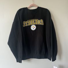 Hey there vintage lovers! This sweatshirt is the perfectly worn in piece for any Steelers fan. Vintage y2k. The logo is printed on. The fit is perfectly comfy and oversized. Based on measurements I'm going to say it's a 2X. Tag is frayed.  Measurements: taken flat 28" chest  28" long Stored in a smoke free environment. Thank you for stopping by my shop! Follow @windfallvtg on Instagram for sneak peeks, shop updates, and sales! Bin 12 Throwback Crew Neck Sweatshirt With Logo Print, Throwback Sweatshirt With Logo Print For Sports Season, Throwback Logo Print Sweatshirt For Sports Season, Sports Season Team Logo Sweatshirt For Streetwear, Team Logo Sweatshirt For Sports Season Streetwear, Throwback Crew Sweatshirt For Sports Season, Black Crewneck Sweatshirt For Game Day, Throwback Long Sleeve Letter Print Sweatshirt, Throwback Team Logo Long Sleeve Sweatshirt